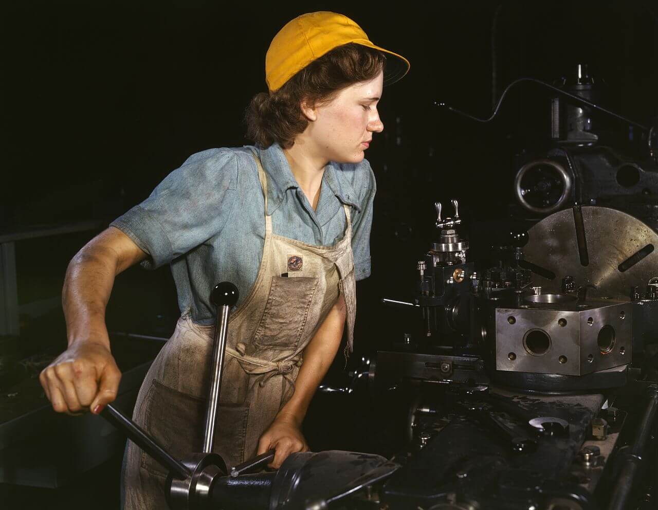 A woman operates a turret lathe at the Consolidated Aircraft Corporation plant in 1942.