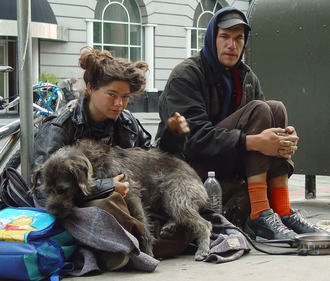 Homeless couple with dog in San Francisco, CA - photographed by Franco Folini.