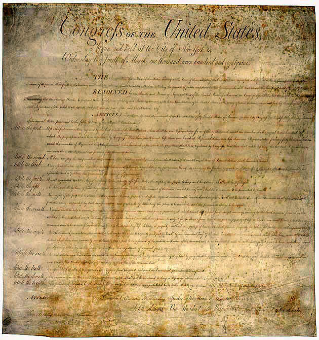 The original Bill of Rights document is now yellowed by age.