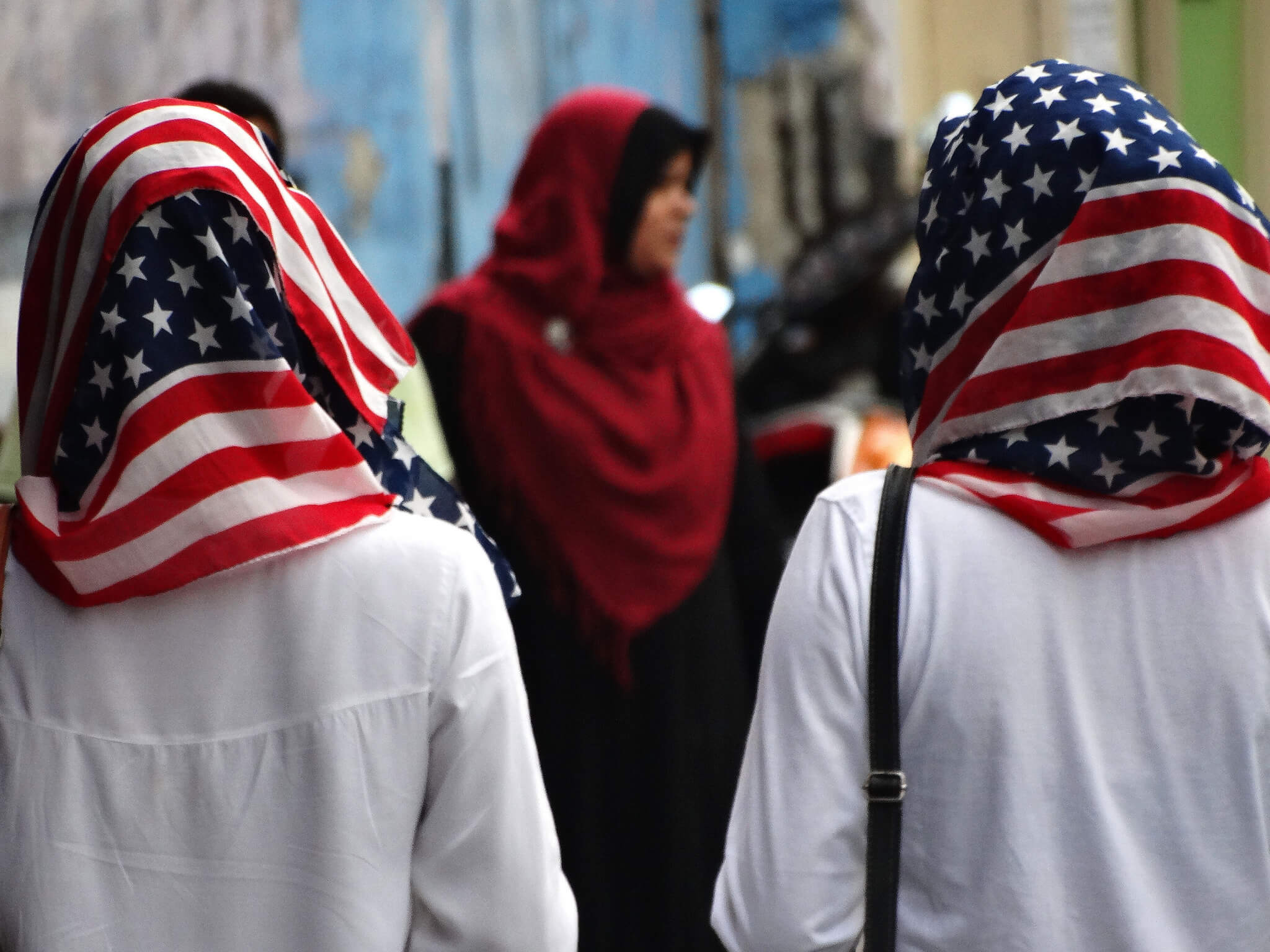 Two Muslim women wear stars-and-stripes hibjabs.